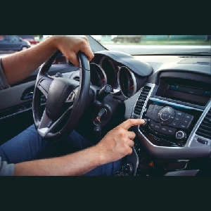 Vehicle dashboard infotainment system with integrated audio controls and display panel